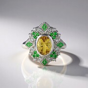 Zilveren ring met een gele beril