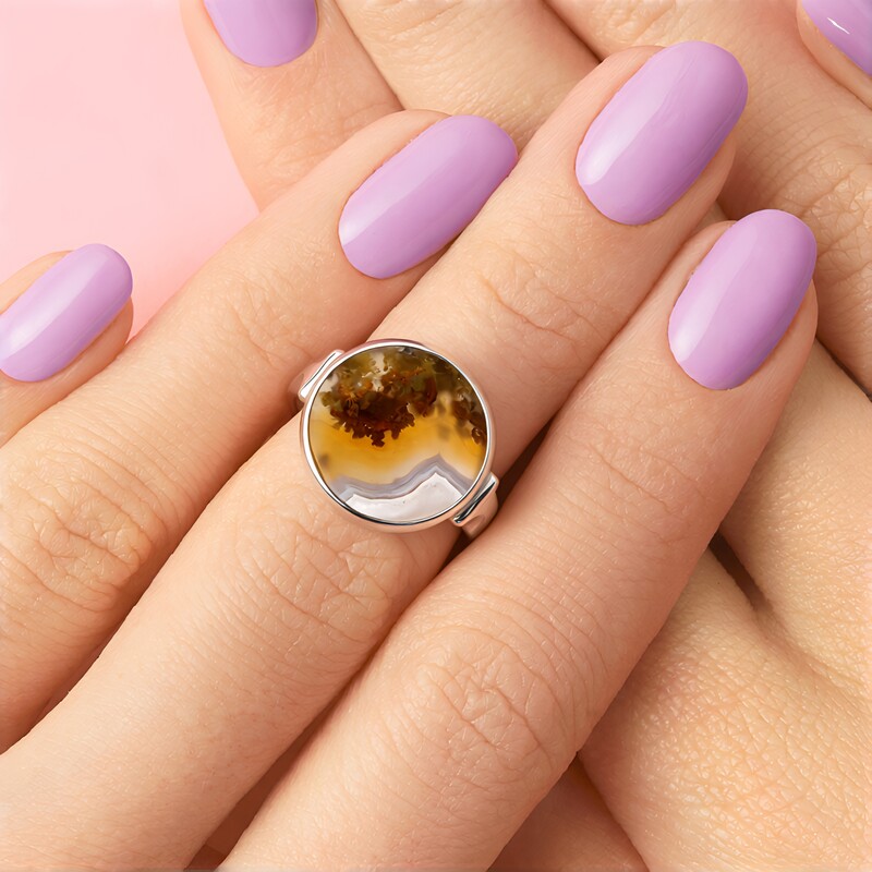 Zilveren ring met een Mosagaat (Bali Barong)