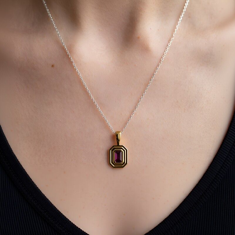 Zilveren hanger met een magenta granaat