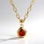 Collana in oro con Spessartina (CIRARI)