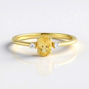 Zilveren ring met een gele beril