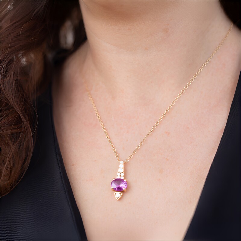 Gouden halsketting met een roze saffier (CIRARI)