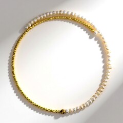 Collier ras du cou en acier et Hématite dorée (Riya)