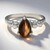 Anello in argento con Occhio di Tigre Rosso