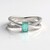 Bague en argent et Émeraude de couleur Paraiba