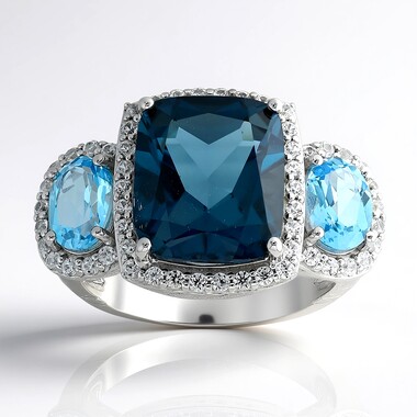 Pierścionek ze srebra rodowanego - Topaz niebieski London Blue (de Melo Essence)